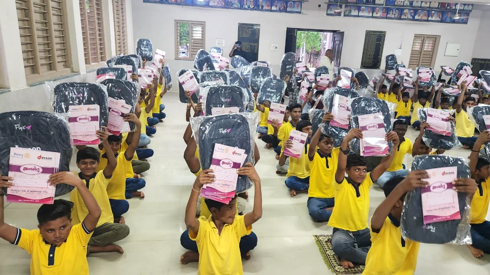 Group of smiling children in a classroom setting